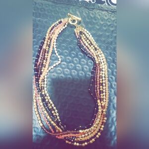 Beaded multiple stranded necklace, gold clasp. Pink, pearl, black and gold beads